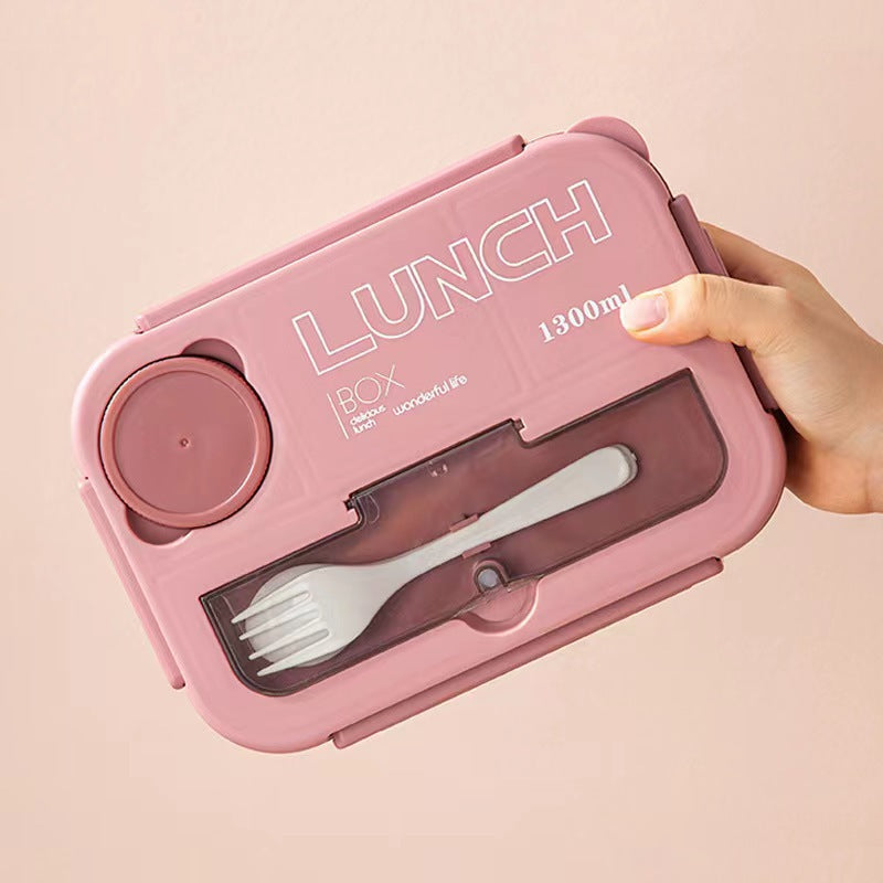 Microwaveable sealed lunch box with compartments and sauce box with cutlery